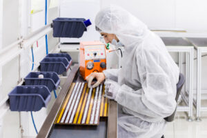 a white clothe scientist working in laboratory